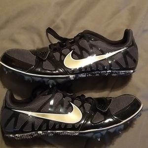 Black and gold Nike sprint shoes